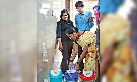 Corporation Commissioner J Radhakrishnan and his wife watch waste segregation at their house in city on Friday