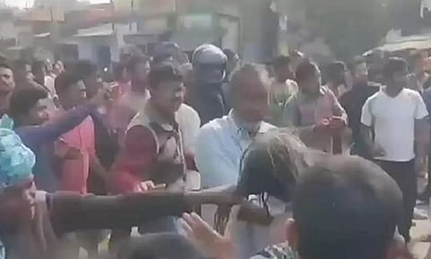 Screengrab from the viral video that shows sadhus (ascetics) group purportedly stripped and assaulted by a mob in the Purulia district on Friday.