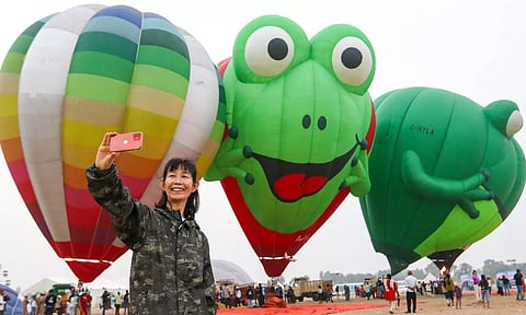 Tryntsje Offringa, the only female pilot, taking a selfie with the hot air balloons in Pollalchi (Photo credits: Hemanathan M)