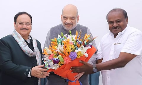 H D Kumaraswamy with Amit Shah and J P Nadda. (X/@hd_kumaraswamy)