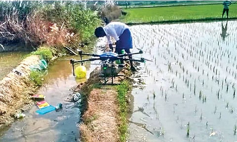 A farmer preparing to use a drone at his field in Nemili taluk in Ranipet