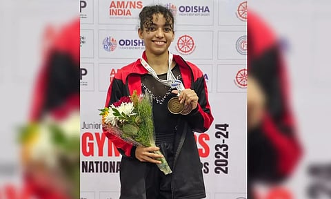 Oceana Renee Thomas poses with her medals at the 2023 Junior Gymnastics National Championships