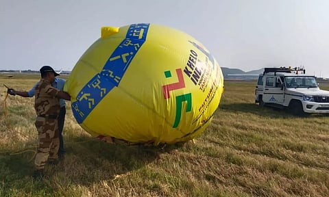 CISF officials clearing the balloon.