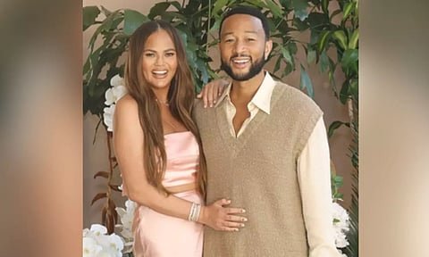 Chrissy Teigen says John Legend was 'jealous' of Carl Radke