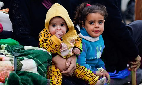Children rest as Palestinians fleeing Khan Younis, due to the Israeli ground operation (Reuters)