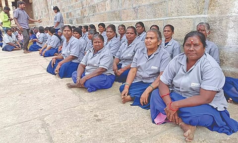 Contract workers of Srirangam Sri Ranganathaswamy temple conducting a sit in protest on Saturday