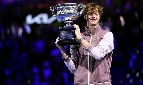 Italy’s Jannik Sinner poses with the Norman Brookes Challenge Cup trophy
