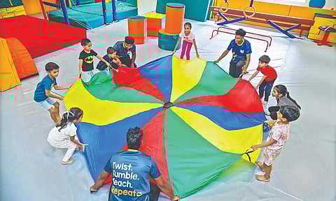 Children engaged in an activity at Tiny Tumbles