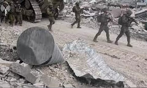 Israeli soldiers operate in the Gaza Strip amid the ongoing conflict between Israel and the Palestinian Islamist group Hamas (Reuters)