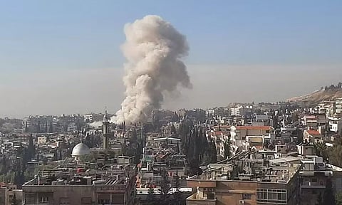 Smoke rises after an Israeli missile strike on Damascus