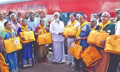 HR&amp;CE Minister Sekarbabu handing over travel kits to devotees on pilgrimage to Kashi on Thursday