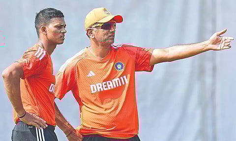 Yashasvi Jaiswal with coach Rahul David during a practice session