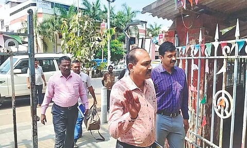 NFSU, CB-CID officials arriving at the BSNL office in Tiruchy on Friday