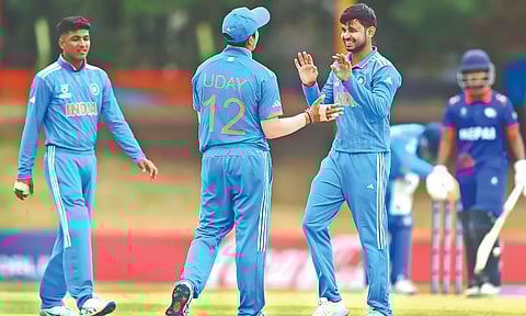 India U-19 players exult after taking a Nepal wicket