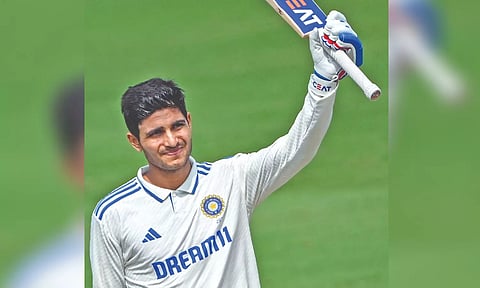 Shubman Gill celebrates after scoring his century
