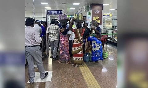 A group of construction workers gathered at Central Metro station with different equipment to travel to Nandanam on Tuesday morning. (File)