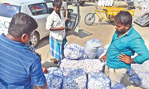 File photo of unsold garlic bags in large numbers in the Koyambedu wholesale market