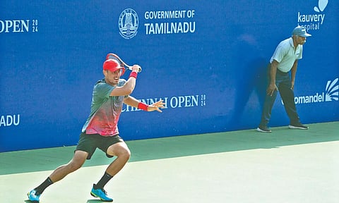 Bernard Tomic in action on Tuesday
