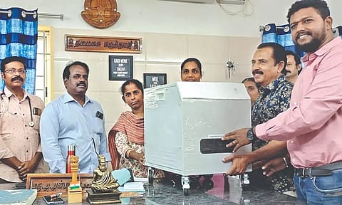 Dr Haja Maideen handing over ventilator compressor at Pattukkottai Government Hospital on Wednesday