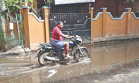 A two-wheeler seen riding through a sewage-logged stretch in Perambur