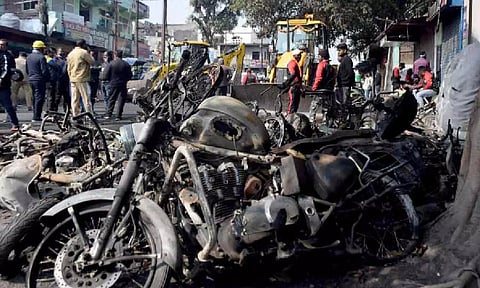 Burnt motorbikes lie on a road a day after clashes during a government demolition drive, in Haldwani, Uttarakhand. (PTI)PTI picture.