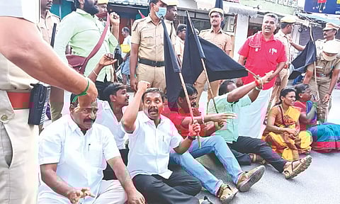Protesting CPM members being removed by cops in Tiruvanaikoil on Saturday