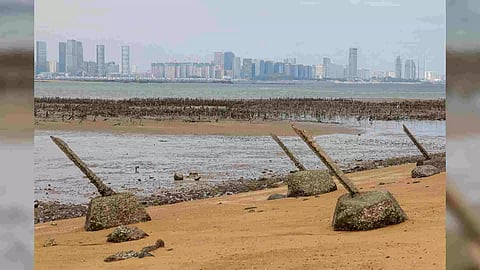 Anti-landing barricades are seen on the beach with China's Xiamen in the background in Kinmen (Photo/Reuters)