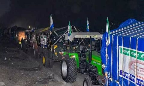 Tractors and trolleys parked roadside ahead of the ‘Delhi Chalo’ march by farmers in Fatehgarh Sahib on Monday. (PTI)