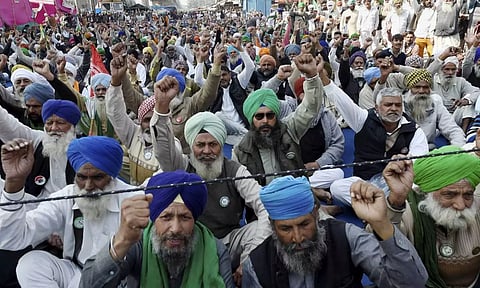 Farmers protesting against the Centre's new farm laws at the Tikri border in New Delhi on February 6. (PTI)