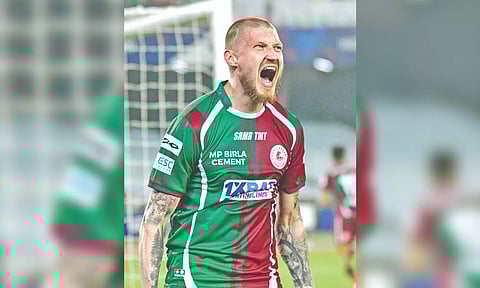 Jason Cummings celebrates after scoring a goal