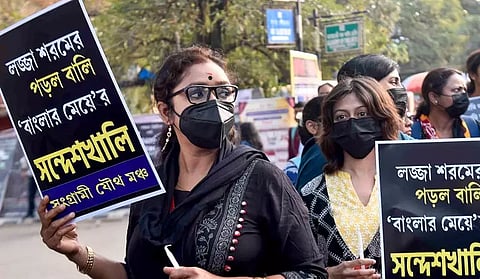 Members of Sangrami Joutha Mancha hold placards during a protest against Sandeshkhali case, in Kolkata (PTI)&nbsp;
