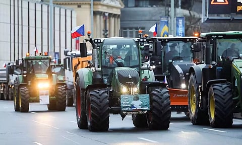 Farmers drive tractors during a protest against European Union agricultural policies (Reuters)