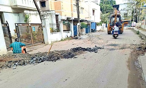 Newly re-laid road dug up for underground sewage connection work in Madipakkam