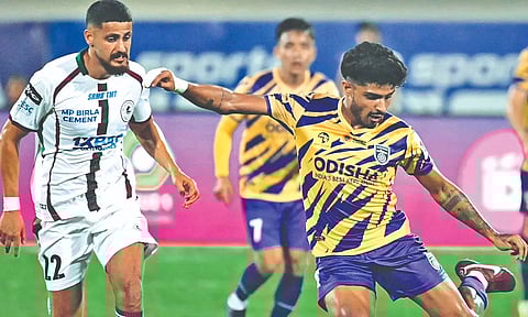 Amey Ranawade (R) takes a shot during the match