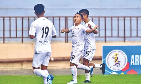 Mizoram players celebrate after scoring a goal against Karnataka