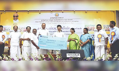 Chief Minister MK Stalin presenting compensation to flood victims from southern districts in Thoothukudi on Sunday