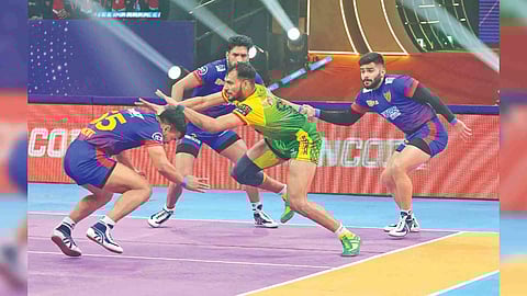 Patna Pirates captain Sachin Tanwar goes for a raid against Delhi in the Eliminator 1