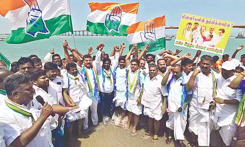 Congress cadre staging a human chain protest on Pamban seashore in Ramanathapuram on Tuesday