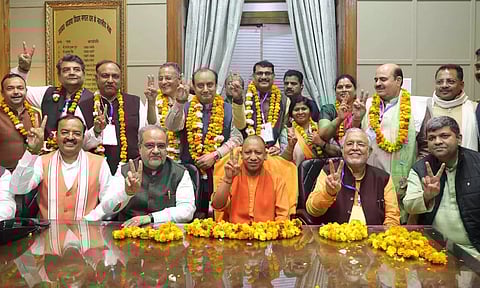 UP Chief Minister Yogi Adityanath, Deputy Chief Minister Keshav Prasad Maurya and other leaders with the BJP candidates (PTI)