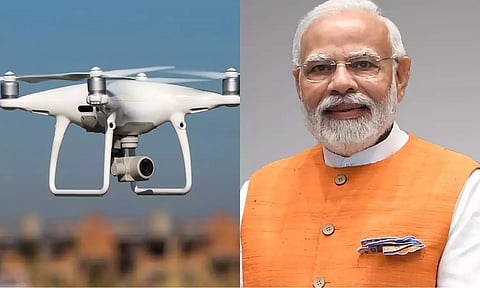 PM Narendra Modi (R)