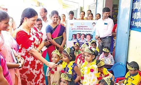 Collector Kalaiselvi Mohan interacts with newly enrolled Class 1 kids