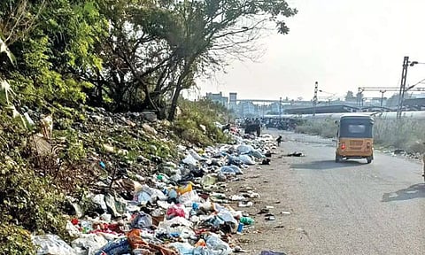 Waste and debris accumulated on the road adjacent to the Pallavaram Railway Station