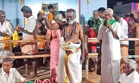 Temple priest shows the lemon which fetched whopping sum during auction