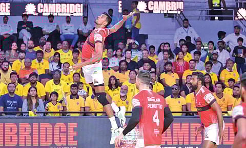 Player of the match Jerome Vinith takes a serve during the match
