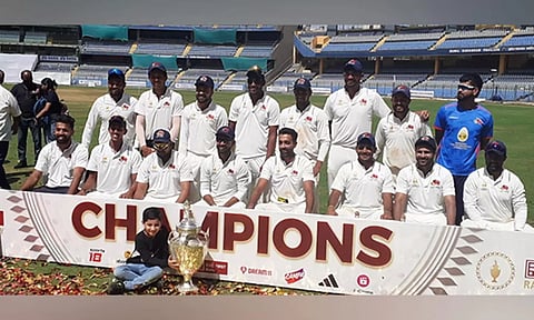 Mumbai team posing with the trophy. ANI