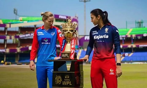 Rival captains Meg Lanning and Smriti Mandhana pose with the trophy