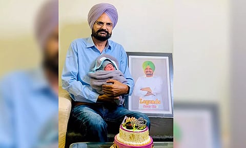 Balkaur Singh with newly born child. (Balkaur Singh/Facebook)