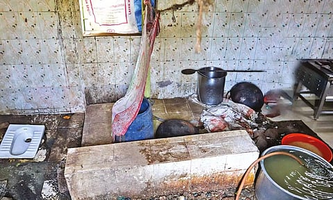 A thin make-shift barrier divides the toilet from the stove; dirty water and floors common in almost all canteens Korattur Area (Photos: Hemanathan M)