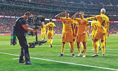 Lamine Yamal (L) and Fermin celebrate Barcelona’s third goal