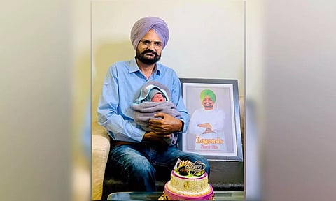 Balkaur Singh with his new born child (Balkaur Singh/Facebook)